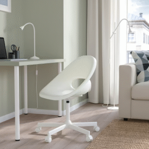 White chair in home office with desk and window