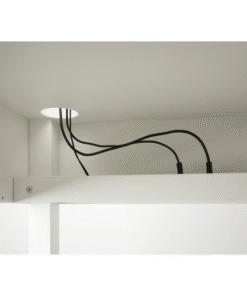 IKEA MICKE corner workstation with cable management hole – top view of cord routing feature in white finish