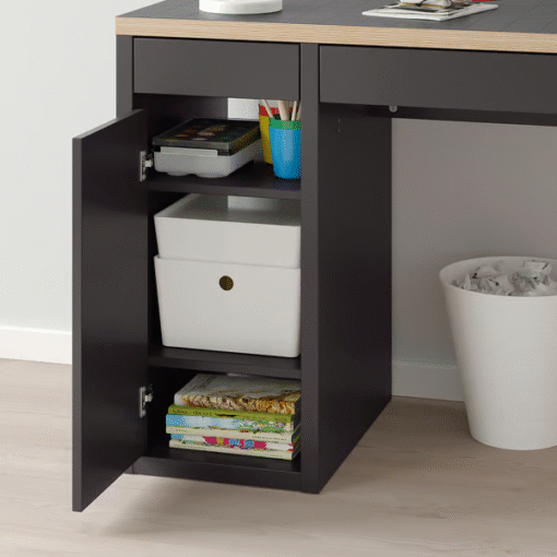 Open shelves of the MICKE red desk with storage bins and books