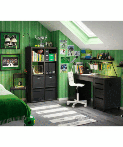 Black-brown desk in a green-themed kids’ room with bookshelves and white chair