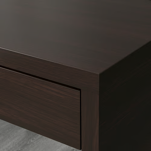 close-up of black-brown MICKE desk surface and drawer front
