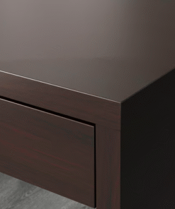 Close-up of black-brown MICKE desk corner showing wood texture