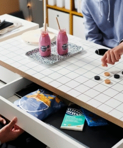 Snacks and games stored in the MICKE desk drawer