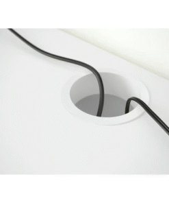 Close-up of cable management hole on white MICKE desk