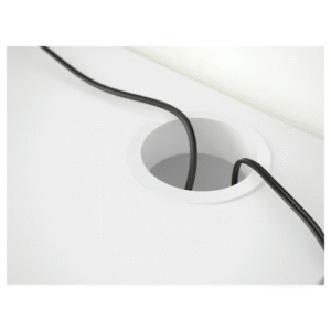 Close-up of cable management hole on white MICKE desk