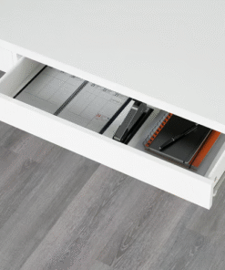 Open drawer in MICKE desk with notebook and accessories inside