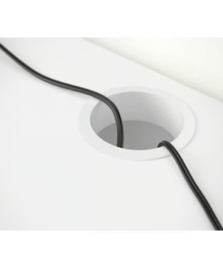 Cable outlet hole in white desk for clean wire management
