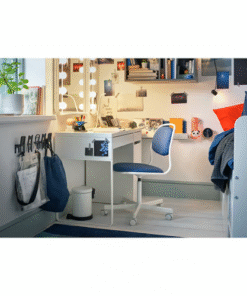 White desk with drawer and blue chair in a bright bedroom setup with vanity lights