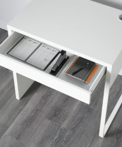 open drawer of white MICKE desk with planner and stationery