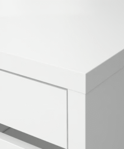 Minimalist white desk surface close-up with clean modern edges