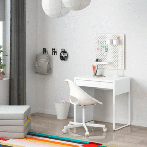white MICKE desk in kids room with pegboard and swivel chair